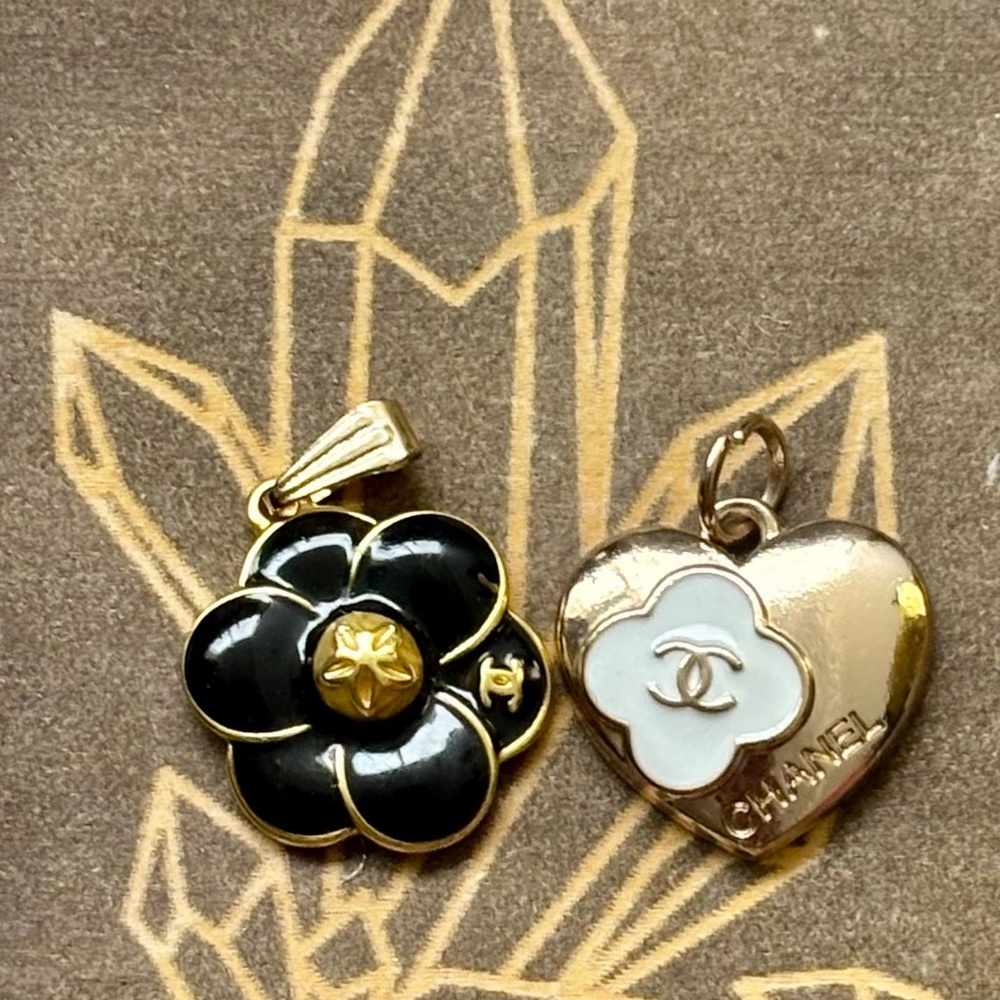 CHANEL Black and Gold Floral Pendant OR CHANEL Heart with White Camilla Floral s